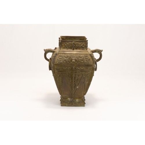 96 - An Archaic Chinese Style Wine Vessel Decorated with Animal Carvings.

H: Approximately 35cm