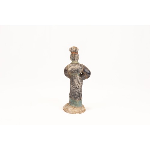 99 - A Chinese Terracotta Figure of a Female Attendant Standing on a Circular Base from  the Qing Dynasty... 