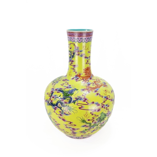 101 - A Large Chinese Porcelain Yellow Ground Famille Rose Vase from the 19th Century.