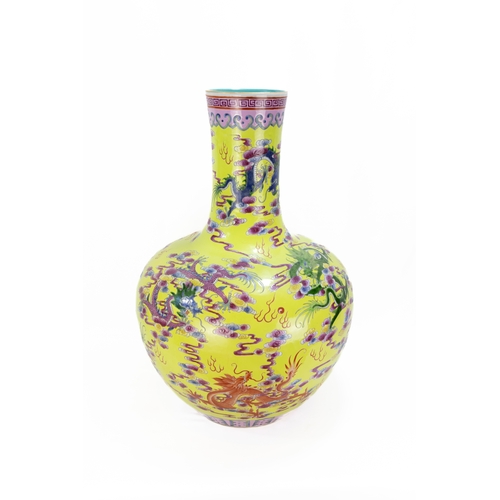 101 - A Large Chinese Porcelain Yellow Ground Famille Rose Vase from the 19th Century.