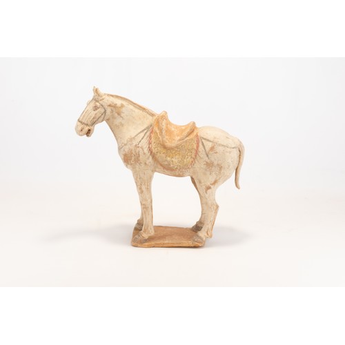 104 - A Chinese Pottery Figure of a Horse with a Saddle from the Tang Dynasty.

H: Approximately 28cm
L: A... 