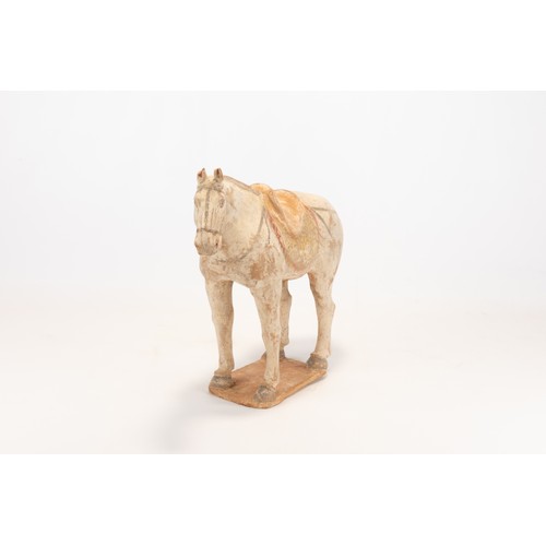 104 - A Chinese Pottery Figure of a Horse with a Saddle from the Tang Dynasty.

H: Approximately 28cm
L: A... 