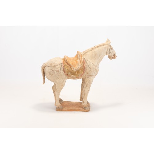 104 - A Chinese Pottery Figure of a Horse with a Saddle from the Tang Dynasty.

H: Approximately 28cm
L: A... 