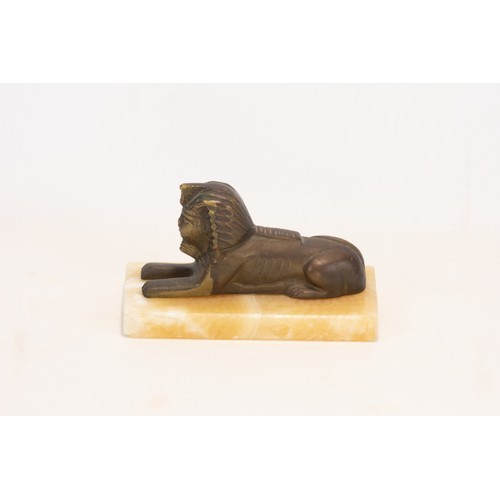 252 - **NO RESERVE**
An Egyptian Bronze & Alabaster Figure of a Sphinx.

Approximately 13.8x7x7.8cm