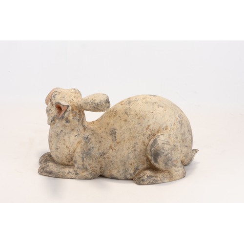 109 - A Chinese Terracotta Figure of a Rabbit from the Han Dynasty.

L: Approximately 27cm
H: Approximatel... 