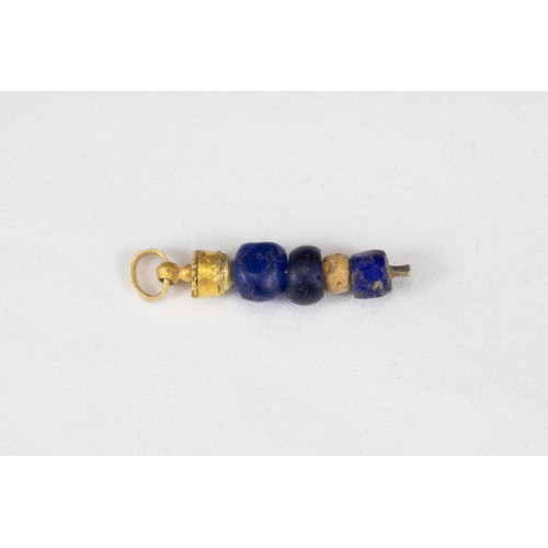 311 - A Western Asiatic Gold & Glass Pendant Circa 1st Millennium B.C.

L: Approximately 2.5cm
2.50g