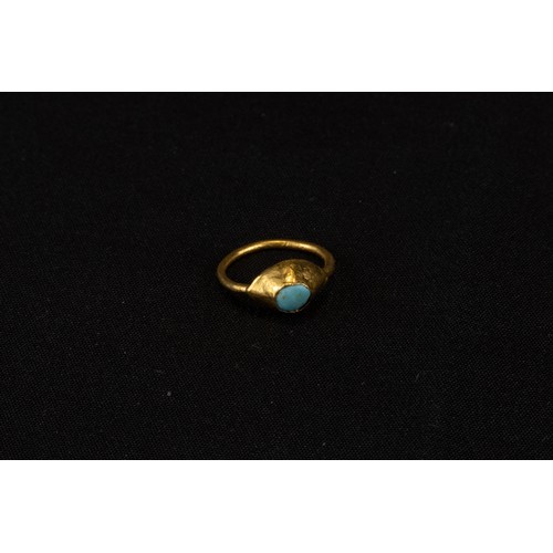 315 - A Byzantine Gold Child's Ring with a Turquoise Stone from 1000-1400 A.D.

Approximately 1.4x1.1cm
In... 