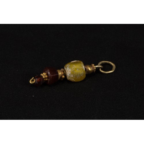 317 - A Western Asiatic Gold Pendant with Glass, Jasper & Garnet Beads Circa 1st Millennium B.C.

Approxim... 