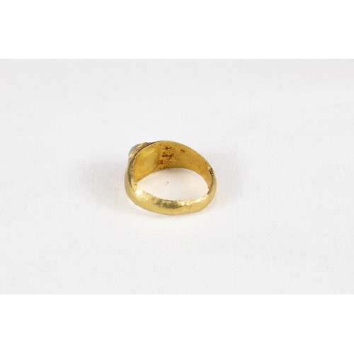 321 - An Ancient Roman Gold Ring with Glass Cabochon Circa 2nd Century A.D.

Internal D: 1.2cm
0.75g