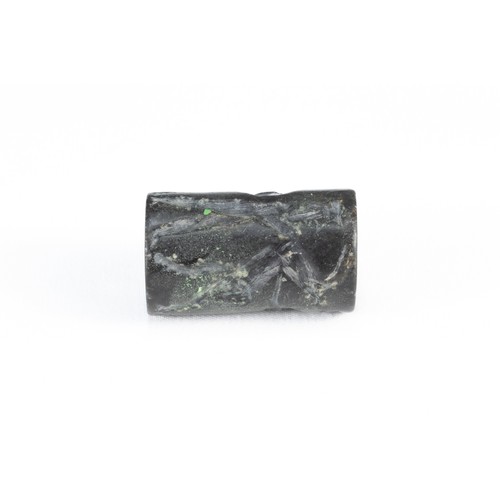 329 - A Mesopotamian Black Hardstone Cylinder Seal with Zoomorphic Figures Carved on its Sides Circa 2nd-1... 