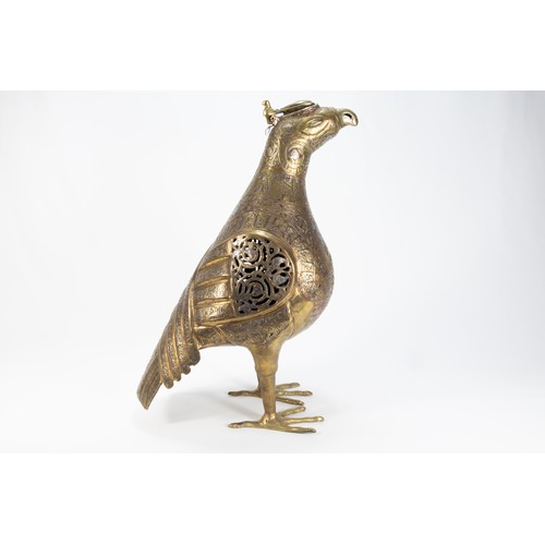 165 - An Islamic Bronze Figure of a Bird Decorated with Kufic Inspirations and Floral Patterns in Silver I... 