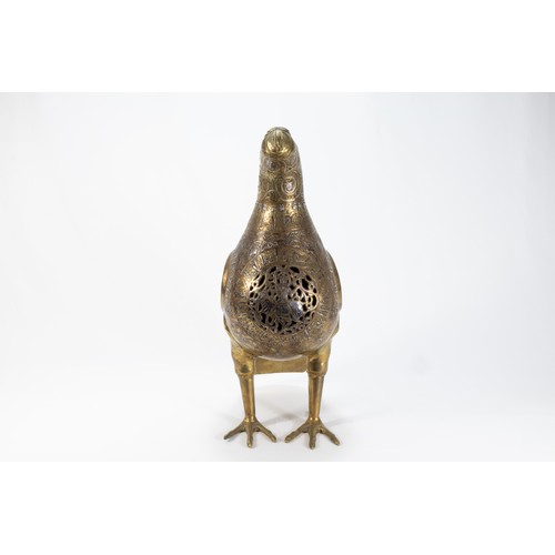 165 - An Islamic Bronze Figure of a Bird Decorated with Kufic Inspirations and Floral Patterns in Silver I... 