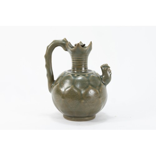 80 - A Chinese Green Celadon Jug with Lid

H: Approximately 15cm