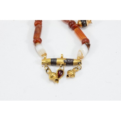 22 - A Roman Carnelian Necklace with a Gold Pendant Decorated with Garnet Stones from 625 BC- 476 AD.

Ha... 