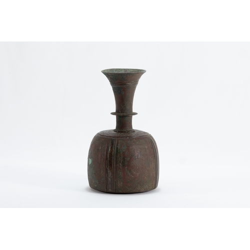 174 - An Islamic Khorasan Bronze Perfume Bottle from the 12th Century.

H: Approximately 18.5cm