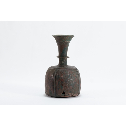 174 - An Islamic Khorasan Bronze Perfume Bottle from the 12th Century.

H: Approximately 18.5cm