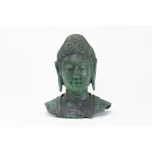 87 - A Chinese Tibetan Bronze Buddha Head with Green Patina.

H: Approximately 25cm