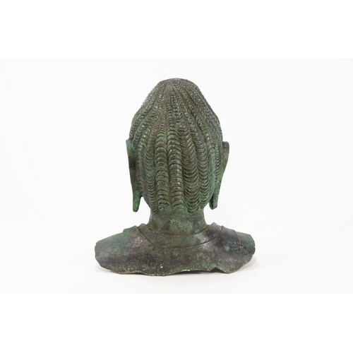 87 - A Chinese Tibetan Bronze Buddha Head with Green Patina.

H: Approximately 25cm