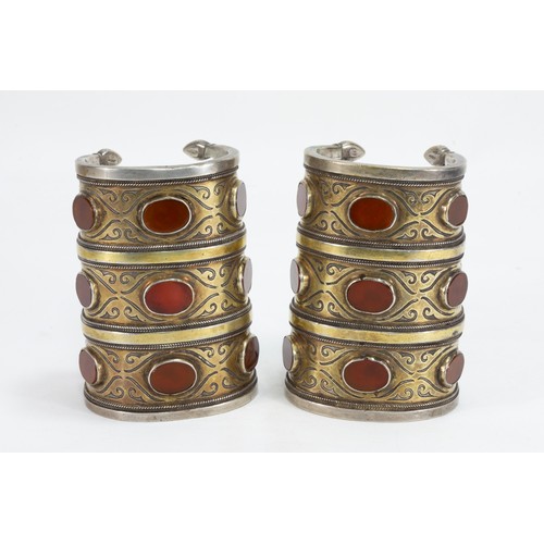 321 - A Pair of Tribal Afghan Turkmen Silver Gilded Bracelets Decorated with Carnelian Stones.

557g