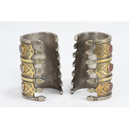 321 - A Pair of Tribal Afghan Turkmen Silver Gilded Bracelets Decorated with Carnelian Stones.

557g