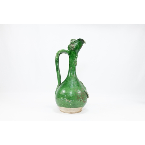 190 - An Islamic Turkish Ottoman Canakkale Olive-Green Glaze Pottery Ewer from the 19th Century.

H: Appro... 