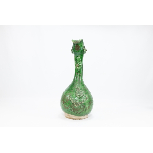 190 - An Islamic Turkish Ottoman Canakkale Olive-Green Glaze Pottery Ewer from the 19th Century.

H: Appro... 