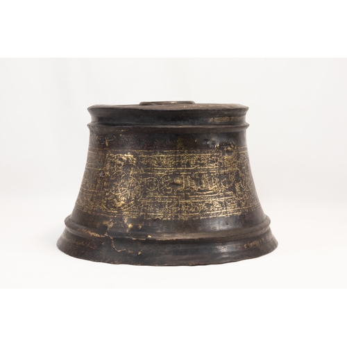 192 - An Islamic Mamluk Bronze Candlestick from the 14th Century Decorated with Engravings.

H: Approximat... 