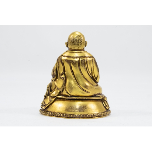 41 - A Tibetan Bronze Gold Gilt Figure of a Lama in Meditation from the 19th Century.

H: Approximately 8... 