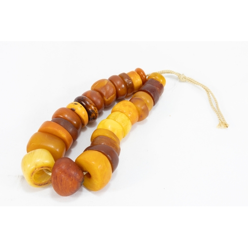 323 - A Tribal Moroccan Amber Beads Necklace.

Half breaded length: Approximately 13.5cm

55.3g