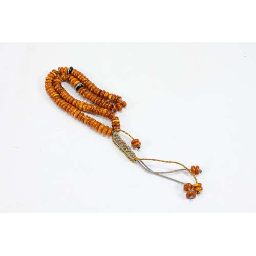 193 - An Islamic Butterscotch Amber Prayer Beads Tasbih Containing 99 Beads.

Half breaded length: 19cm
30... 