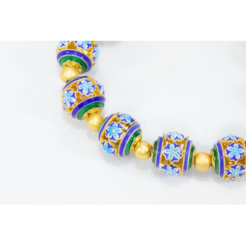 106 - A Chinese Enamel Bracelet with Turquoise and Emerald Coloured Beads.

L: Approximately 8.5cm