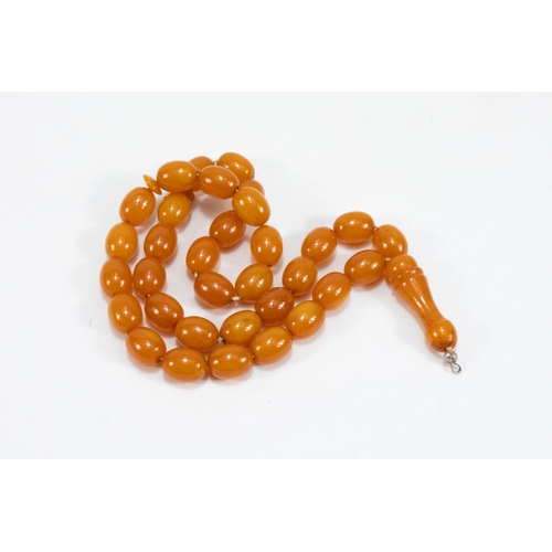 194 - An Islamic Single Strand Butterscotch Amber Prayer Beads Tasbih.

Half breaded length: Approximately... 