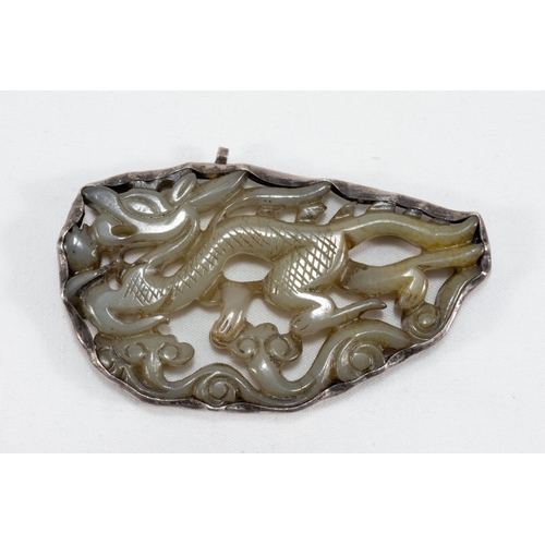 107 - A Chinese Carved Jade & Silver Pendant.

L: Approximately 7cm