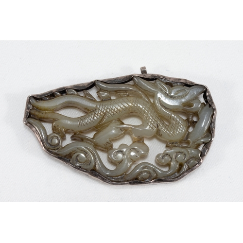 107 - A Chinese Carved Jade & Silver Pendant.

L: Approximately 7cm