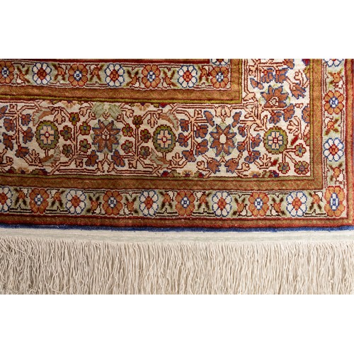 74 - A Turkish Silk Hereke Rug

Warp: Silk
Weft: Silk
Pile: Silk

Approximately 143cm x 95cm