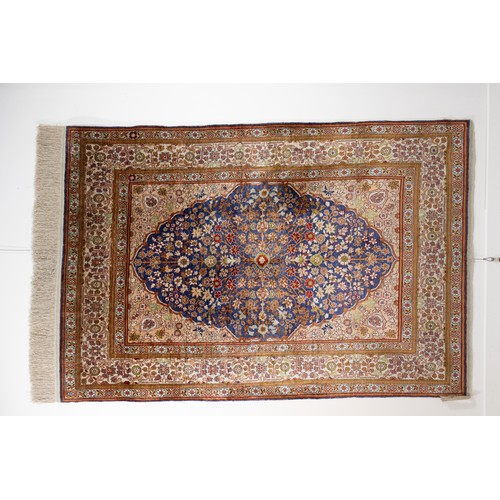 74 - A Turkish Silk Hereke Rug

Warp: Silk
Weft: Silk
Pile: Silk

Approximately 143cm x 95cm