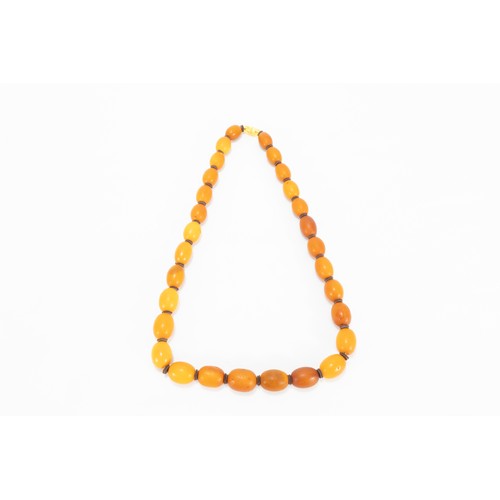 329 - A Single Strand Graduated Butterscotch Amber & Leather Beads Necklace.

52g

L: Approximately 57.5cm