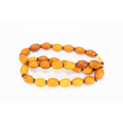 329 - A Single Strand Graduated Butterscotch Amber & Leather Beads Necklace.

52g

L: Approximately 57.5cm