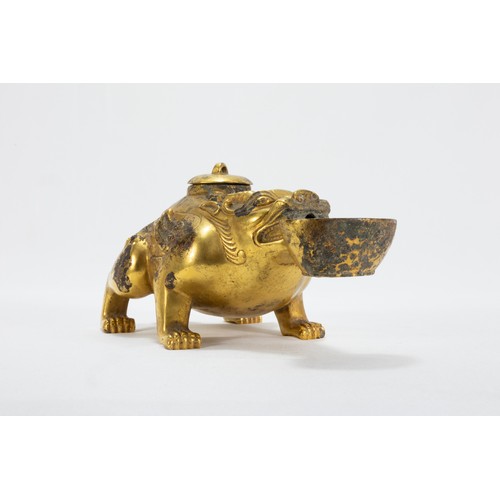 113 - A Chinese Bronze Gilted Oil Lamp in the Form of a Dog with a Bowl in his Mouth.

L: Approximately 16... 