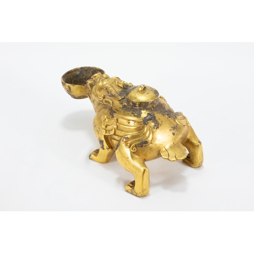 113 - A Chinese Bronze Gilted Oil Lamp in the Form of a Dog with a Bowl in his Mouth.

L: Approximately 16... 