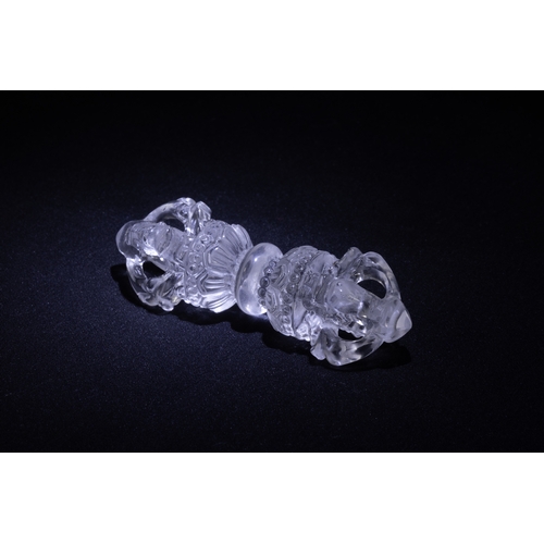 59 - A Tibetan Hand-Carved Crystal  Vajra. 

L: Approximately 6.5cm