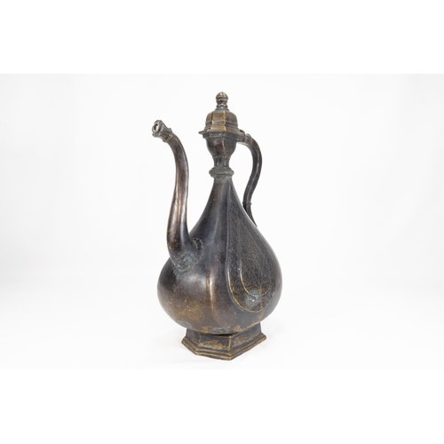 202 - An Islamic Indian Mughal Bronze Ewer Decorated with Floral Patterned Carvings & Sprout in the Form o... 