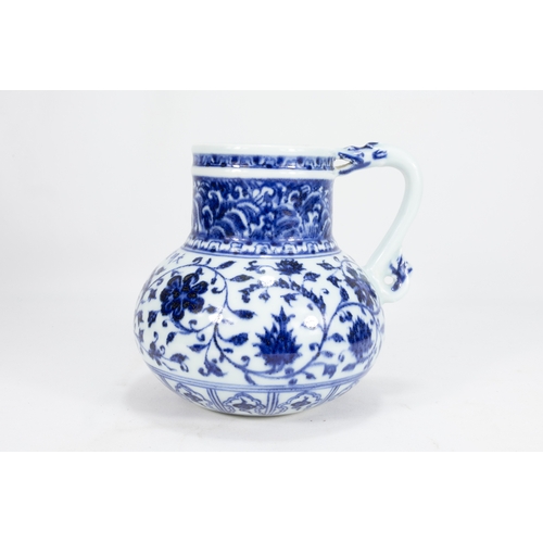 127 - A Chinese Blue & White Porcelain Jug Decorated with Floral Patterns 

H: Approximately 14.8cm