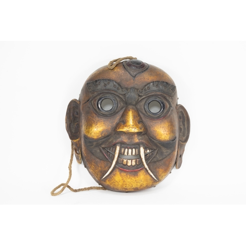 63 - A Tribal Tibetan Bronze Buddhist Wall Hanging Mask from the 19th Century.

Approximately 29cm x 29cm... 