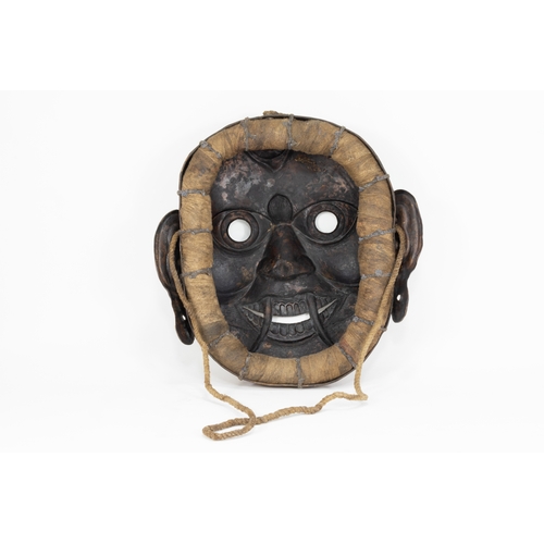 63 - A Tribal Tibetan Bronze Buddhist Wall Hanging Mask from the 19th Century.

Approximately 29cm x 29cm... 