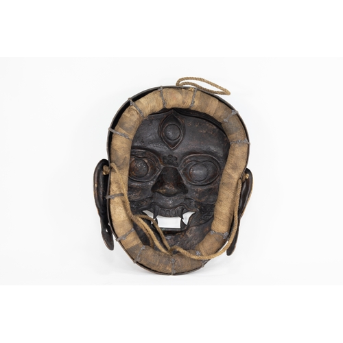 66 - A Tribal Tibetan Bronze Buddhist Wall Hanging Mask from the 19th Century.

Approximately 32.5cm x 27... 