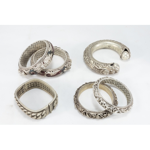 337 - A Collection of 4 Tribal Chinese Tibetan White Metal Bangles.

576g