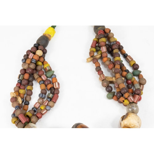 343 - A Large Tribal Moroccan Amber Coloured Beads Necklace.

Half breaded length: Approximately 35cm

410... 