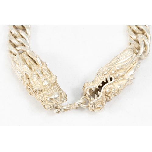 345 - A Large Chinese White Metal Necklace Depicting Dragons on Both Ends.

Half breaded length: Approxima... 