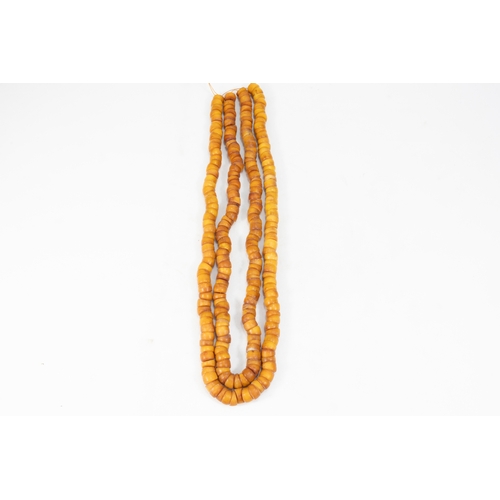 346 - A Pair of Tribal Moroccan Amber Coloured Beads Necklaces.

Half breaded length: Approximately 31cm &... 